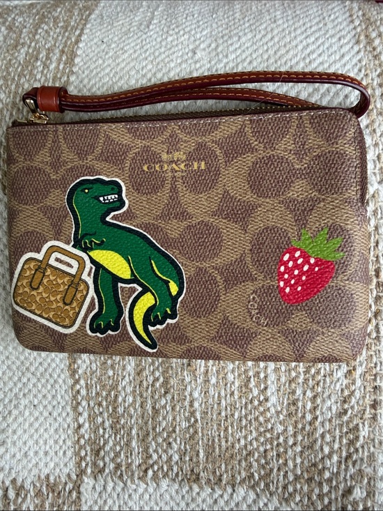 Coach Handbags - NWT Coach Zip Wristlet in Signature Canvas with Sticker Print [limited edition]